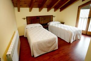 Letto o letti in una camera di Hotel El Jaç
