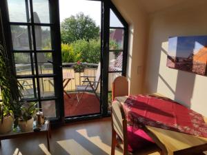 a room with a door open to a balcony at Ferienwohnung Thum in Wustrow