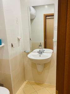 a bathroom with a sink and a toilet at Studio Kris Villa Park in Borovets