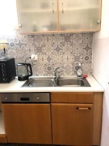 a kitchen counter with a sink and a stove at Apartment in Alf in Alf
