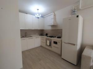 Kuchyň nebo kuchyňský kout v ubytování AVALON Apart-Hotel