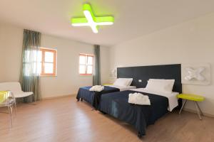 Voodi või voodid majutusasutuse VELANERA Hotel & Restaurant toas