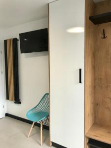 TV a/nebo společenská místnost v ubytování Apartamenty Chata u Rybaka