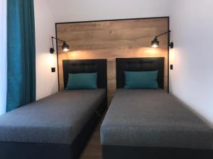 Postel nebo postele na pokoji v ubytování Apartamenty Chata u Rybaka