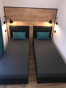 Postel nebo postele na pokoji v ubytování Apartamenty Chata u Rybaka