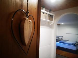 a heart shaped door in a room with a bedroom at Haus Crestas in Samnaun