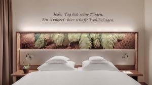 Ein Bett oder Betten in einem Zimmer der Unterkunft Hotel Almesberger