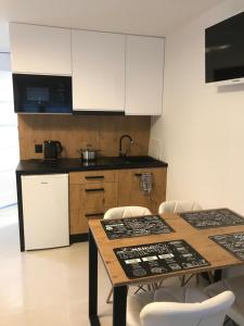 Kuchyň nebo kuchyňský kout v ubytování Apartamenty Chata u Rybaka