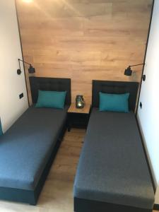 Postel nebo postele na pokoji v ubytování Apartamenty Chata u Rybaka