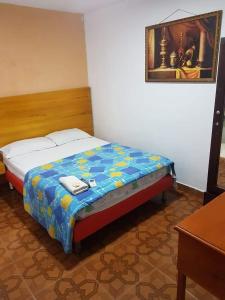 A bed or beds in a room at hotel interamericano