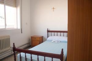 Cama o camas de una habitación en Albergue Santa Olaia