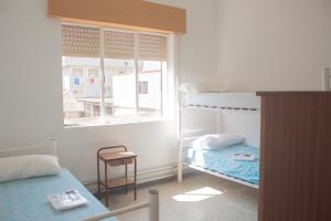 Cama o camas de una habitación en Albergue Santa Olaia