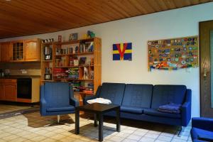 a living room filled with furniture and a coffee table at Hostel Bad Salzig in Boppard