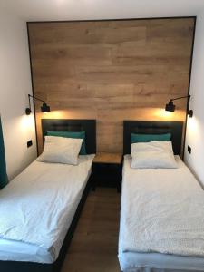 Postel nebo postele na pokoji v ubytování Apartamenty Chata u Rybaka