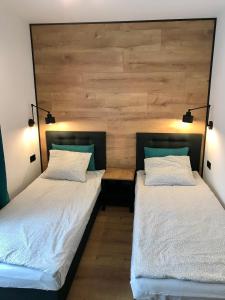 Postel nebo postele na pokoji v ubytování Apartamenty Chata u Rybaka