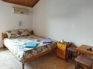 Postel nebo postele na pokoji v ubytování Къща за гости Давидови