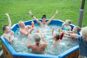 a group of people in a swimming pool at Kuldallika Spa House in Kullamäe