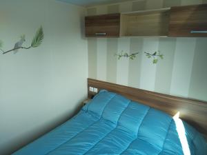 Ένα ή περισσότερα κρεβάτια σε δωμάτιο στο Vacances a Saint Jean de monts