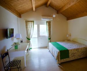 Ένα ή περισσότερα κρεβάτια σε δωμάτιο στο IL FILARO del Castello di San Basilio