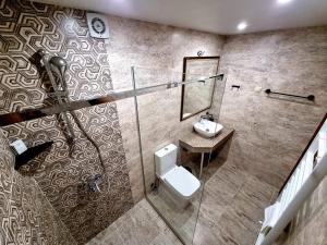 a bathroom with a toilet and a sink at Мяхова Къща in Stara Zagora
