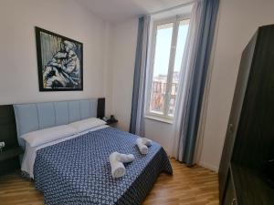a bedroom with a bed and a window at BARBAJA SUITES IN STREET TOLEDO 205 in Naples