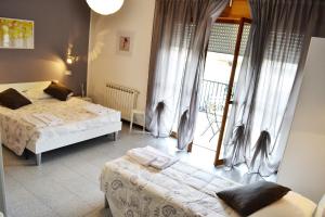 Un pat sau paturi într-o cameră la Sogni D'Oro - Guest House