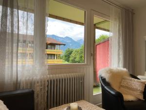 a window with a radiator and a view of a building at Ferienwohnung Rosalie in Inzell