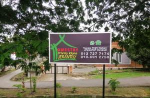 a sign in front of a building at Homestay Dferry Jerantut Fully Aircond in Jerantut