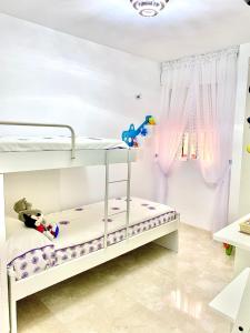 Posteľ alebo postele v izbe v ubytovaní Piso estrella en La Herradura