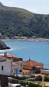 a house with a view of a body of water at Palinuro Villa Bellavista in Palinuro