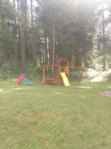 a group of playground equipment in a park at Studio Kris Villa Park in Borovets