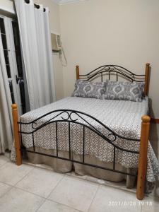a bedroom with a bed with a metal frame at Mega Apartamento in Rio de Janeiro