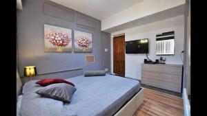 Postel nebo postele na pokoji v ubytování Riviera Penthouse