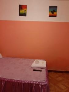 Rúm í herbergi á Hostal Ayllu