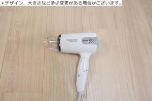 a hair dryer sitting on top of a wooden floor at 松戸の快適ロフトベッド1DK 長期滞在にも Nomad松戸宿005 in Matsudo