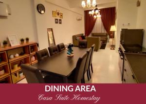 a room with a dining area with a table and chairs at Casa Suite Homestay D'Imperio Professional Suite in Alor Setar