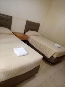 Katil atau katil-katil dalam bilik di Alfa Resort Hotel and Conference