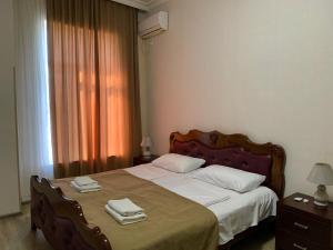 A bed or beds in a room at Hotel Red Bridge