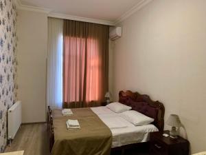 A bed or beds in a room at Hotel Red Bridge