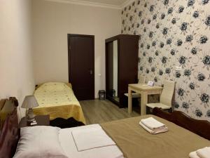 A bed or beds in a room at Hotel Red Bridge