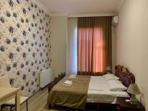 A bed or beds in a room at Hotel Red Bridge