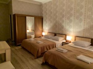 A bed or beds in a room at Hotel Red Bridge