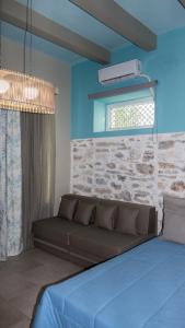 Postel nebo postele na pokoji v ubytování AFISSOS SEASIDE STUDIOS