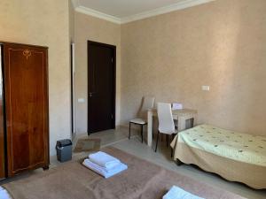 A bed or beds in a room at Hotel Red Bridge