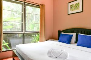 מיטה או מיטות בחדר ב-Flora Ville-SHA PLUS
