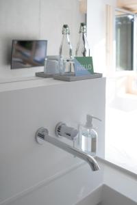 a bathroom with a sink with a faucet at HAAUS in Weinstadt