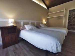 Posteľ alebo postele v izbe v ubytovaní Apartamentos rurales Casa Gorrión - Mazaricos