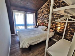 Posteľ alebo postele v izbe v ubytovaní Apartamentos rurales Casa Gorrión - Mazaricos