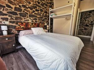 Posteľ alebo postele v izbe v ubytovaní Apartamentos rurales Casa Gorrión - Mazaricos