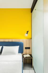 A bed or beds in a room at Dovzhenko